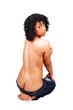 Topless girl kneeling on floor.