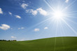 Bright sun over hills