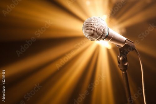Photo: microphone on stage with golden rays microphone on stage with golden rays