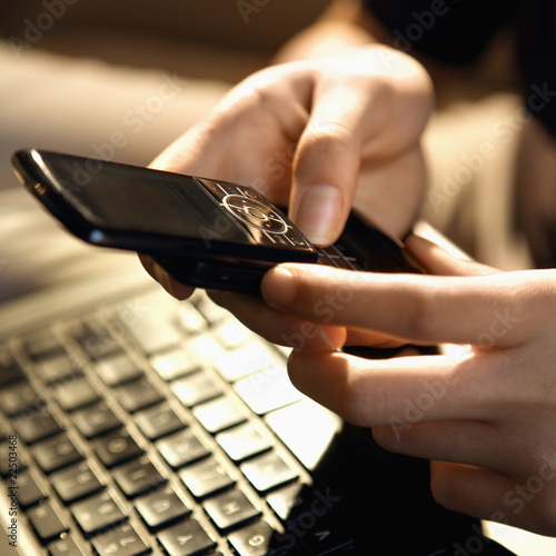 Photo: Woman using cellphone Woman using cellphone
