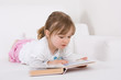 sweet little girl reading book
