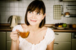 young successful woman, enjoying a cup of coffee in her home.