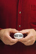 NEST EGG written on egg held by man NEST EGG written on egg held by man