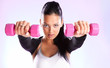Young woman hang up hands weights Young woman hang up hands weights