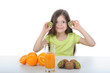 little girl holding slices of kiwi little girl holding slices of kiwi