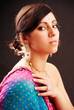 Beautiful indian brunette woman with traditional costume