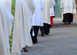 Row of male religious going to church Row of male religious going to church