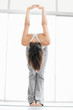 Young female practicing yoga to stay fit