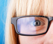 Closeup of a smiling young girl wearing glasses