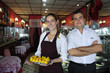 Photo: small business: owner of a cafe and waitress small business: owner of a cafe and waitress