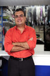 Photo: happy owner of a dry cleaning business happy owner of a dry cleaning business