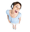 Excited female listening to music on headphones