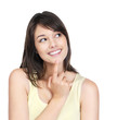 Female with finger on chin looking thoughtfully at copyspace