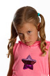 Pretty little girl with a grumpy expression on her face