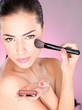 pretty woman applying cosmetic powder brush pretty woman applying cosmetic powder brush