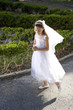 Photo: Beautiful child in white dress holding rosary Beautiful child in white dress holding rosary