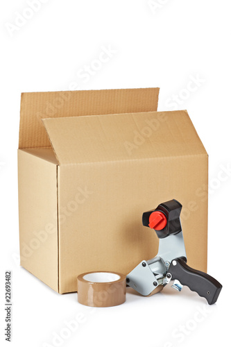 Photo: Packaging tape dispenser and shipping box Packaging tape dispenser and shipping box
