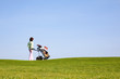 Photo: Golfer and caddy Golfer and caddy