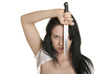 Young woman holds knife in face