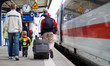 Passengers at train station