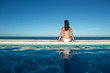 Photos : Woman relaxing in a swimming pool