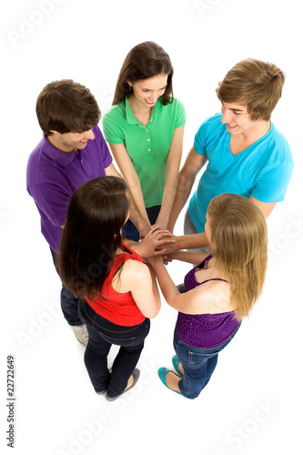Photo: Friends with their hands together Friends with their hands together