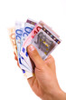 man hand with euro bills over white background