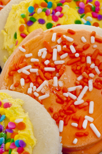 Photo: Yellow and Orange Frosted Sugar Cookies with Sprinkles Yellow and Orange Frosted Sugar Cookies with Sprinkles