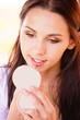 Young woman paints lips
