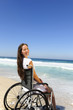 woman in wheelchair enjoying outdoors beach