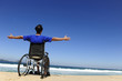 insurance: man in wheelchair enjoying the  beach