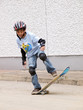 child skateboarding with helmet, knee pads & elbow protection