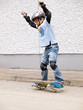 child skateboarding with helmet, knee pads & elbow protection