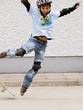 child skateboarding with helmet, knee pads & elbow protection