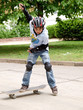 child skateboarding with helmet, knee pads & elbow protection