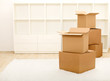 Boxes in front of empty shelves - moving concept