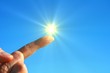 hand sun and blue sky