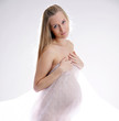 undressed pregnant female holding her breasts undressed pregnant female holding her breasts