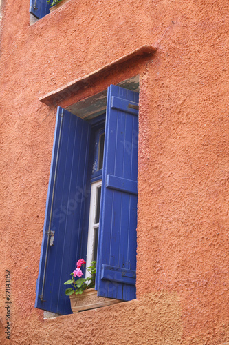Photo: Colorful wall with window in Greece Colorful wall with window in Greece
