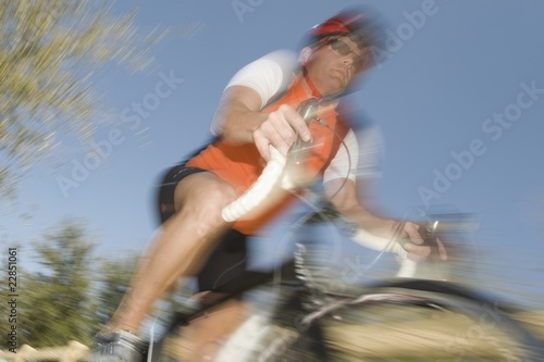 Photo: Male cyclist, blurred motion Male cyclist, blurred motion