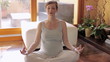 Italian pregnant woman doing yoga at home. Sequence