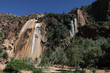 Waterfalls from high mountain with blue sky and trees