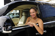 Photo: woman sitting inside of her new 4x4 off-road vehicle woman sitting inside of her new 4x4 off-road vehicle