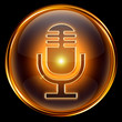 Microphone icon golden, isolated on black background