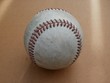 Old, well-worn baseball (hardball)