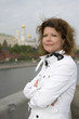 Russian woman and Moscow kremlin close up