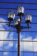 retro lantern against modern building