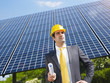 Photo: businessman and solar panels businessman and solar panels