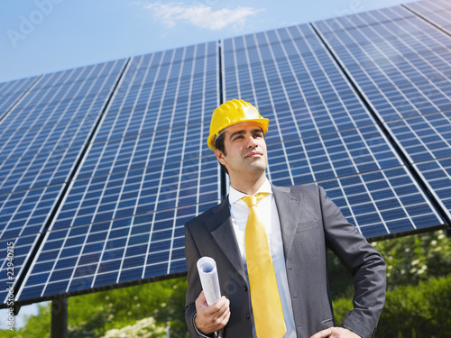 Photo: businessman and solar panels businessman and solar panels