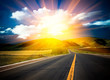 Photo en ligne au meilleur prix sunlight above the road.
